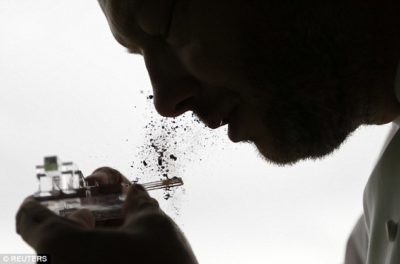 The man behind the "chocolate shooter" is Belgian chocolatier Dominique Persoone. His company, The Chocolate Line, makes a device that is basically a tiny catapult, with two small, spring-loaded spoons that fling cocoa powder into the nostrils.